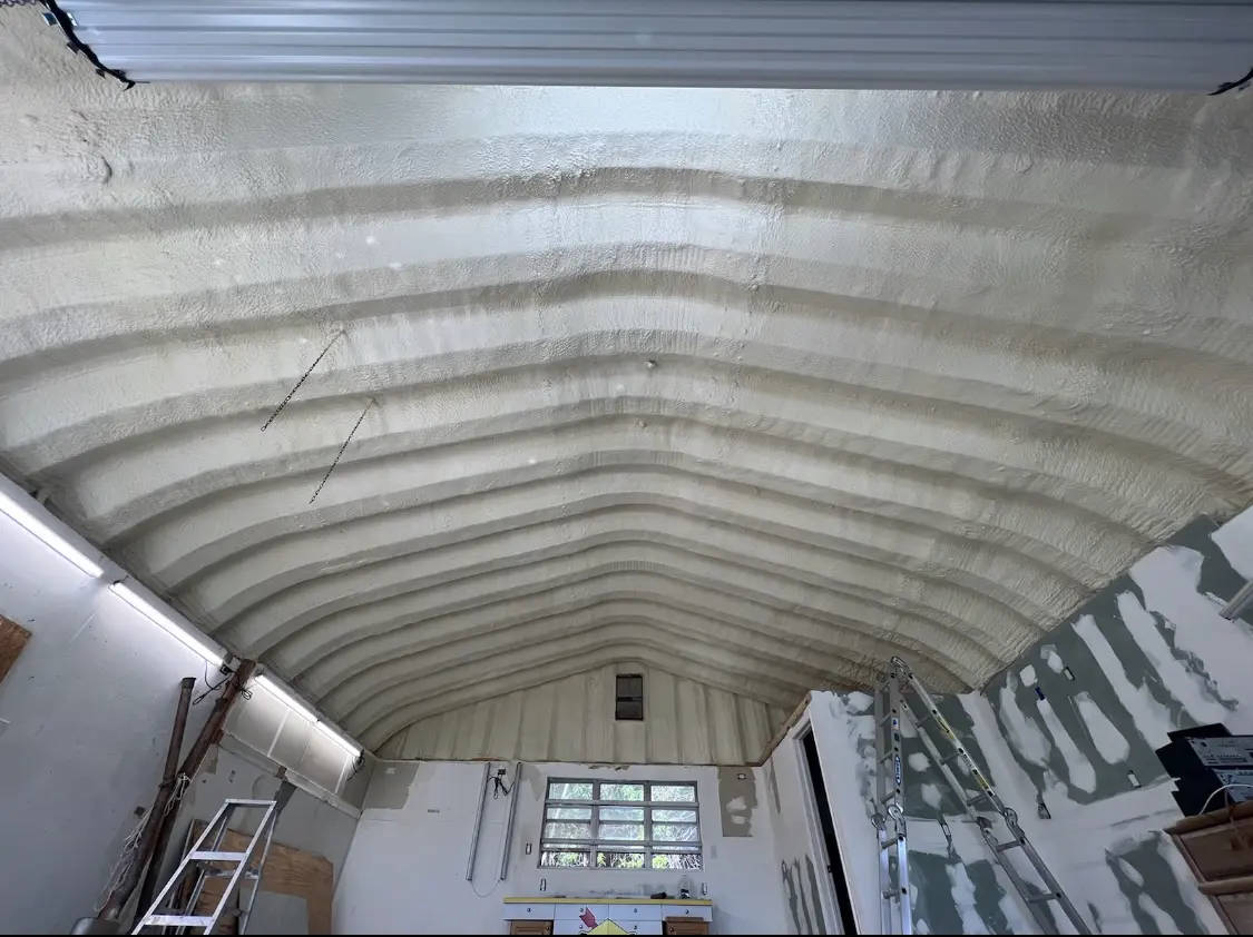 Spray polyurethane foam applied to the underside of a metal roof deck in West Allis